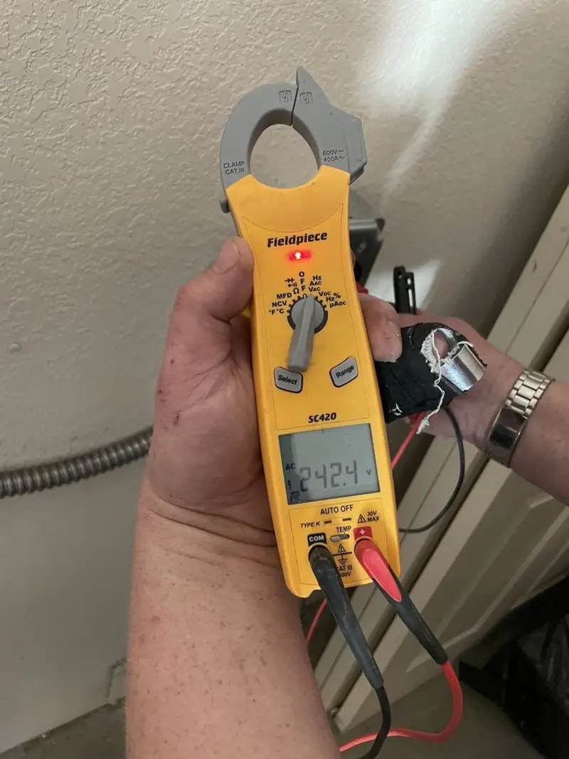 Voltage testing with clamp meter during Recessed Lighting Installation in Wauseon